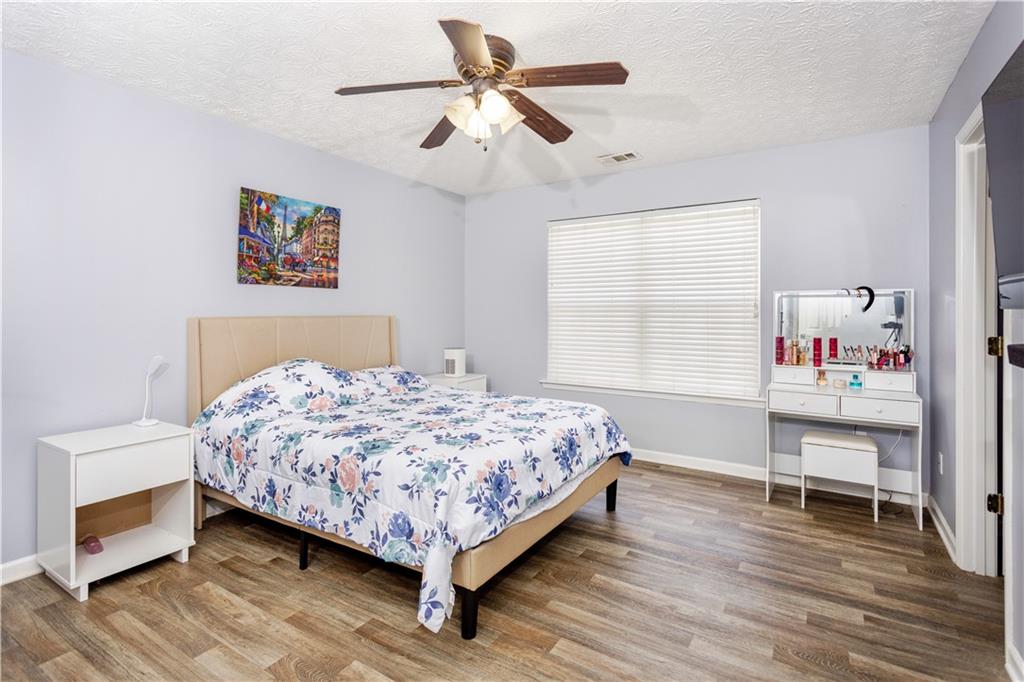 269 Silver Ridge Drive Dallas, GA 30157 - Photo 20 of 33 a bedroom with a bed and a table