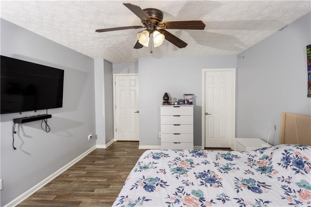 269 Silver Ridge Drive Dallas, GA 30157 - Photo 21 of 33 a bedroom with a bed and a flat screen tv