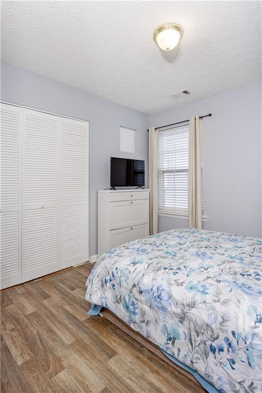 269 Silver Ridge Drive Dallas, GA 30157 - Photo 28 of 33 a bedroom with a bed and a flat screen tv