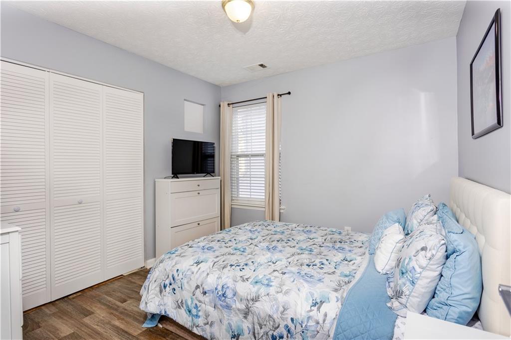 269 Silver Ridge Drive Dallas, GA 30157 - Photo 29 of 33 a bedroom with a bed and a flat screen tv