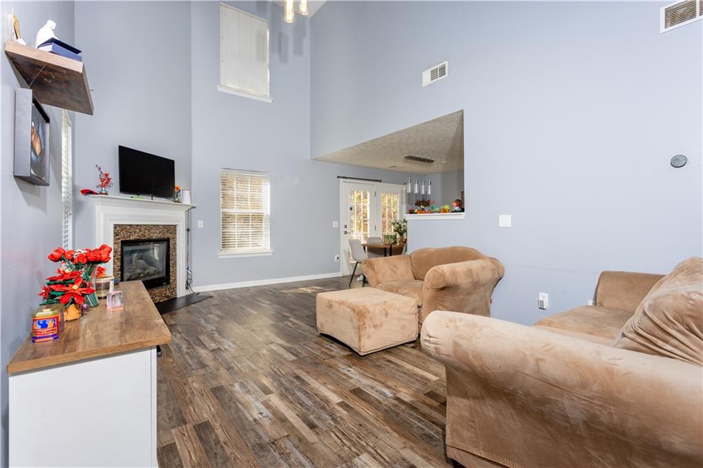 269 Silver Ridge Drive Dallas, GA 30157 - Photo 8 of 33 a living room with furniture and a flat screen tv