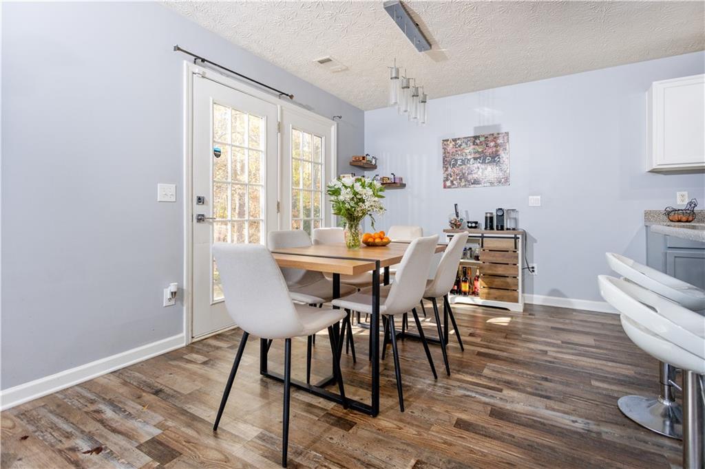 269 Silver Ridge Drive Dallas, GA 30157 - Photo 10 of 33 a dining room with furniture potted plants and wooden floor