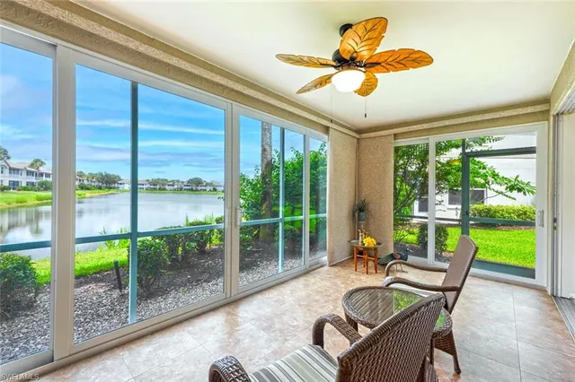 a living room with hardwood floor and balcony
