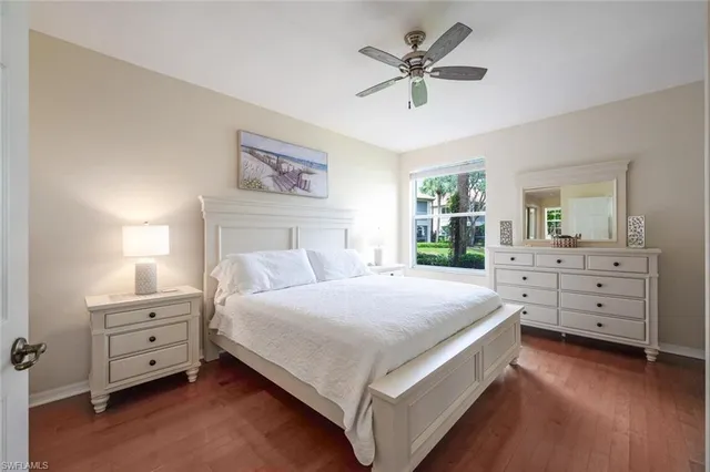 a bedroom with a large bed and a dresser