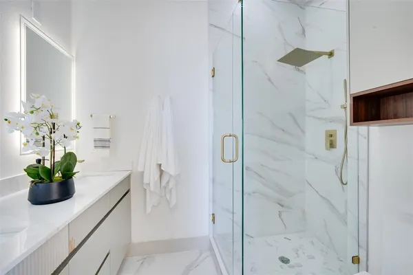 a kitchen with a sink and potted plant