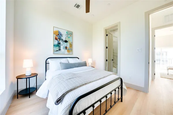 a bedroom with a bed and a dresser