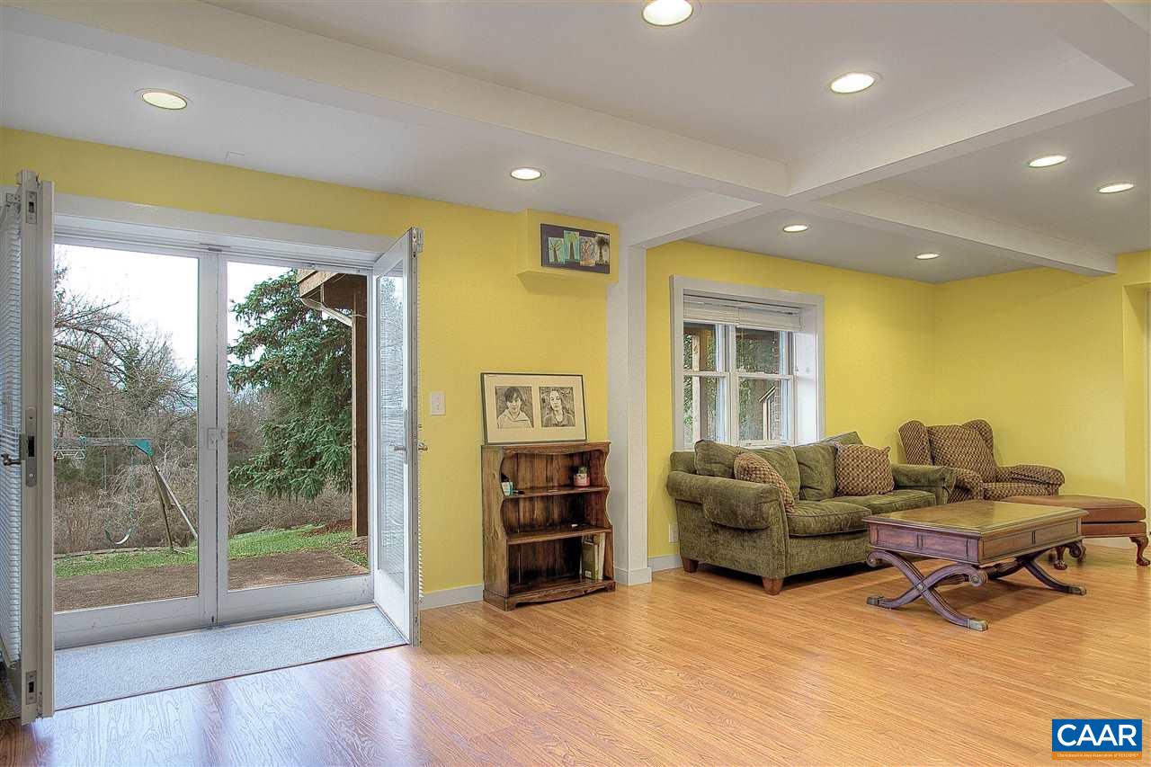 1532 Dairy Road Charlottesville, VA 22903 - Photo 29 of 42 Finished in 2008, the basement is light, functional & nicely finished. A large rec/family room is the heart of the space. Well laid-out recessed fixtures provide strong, balanced light throughout & wood laminate floors in light honey hues keep it soft.