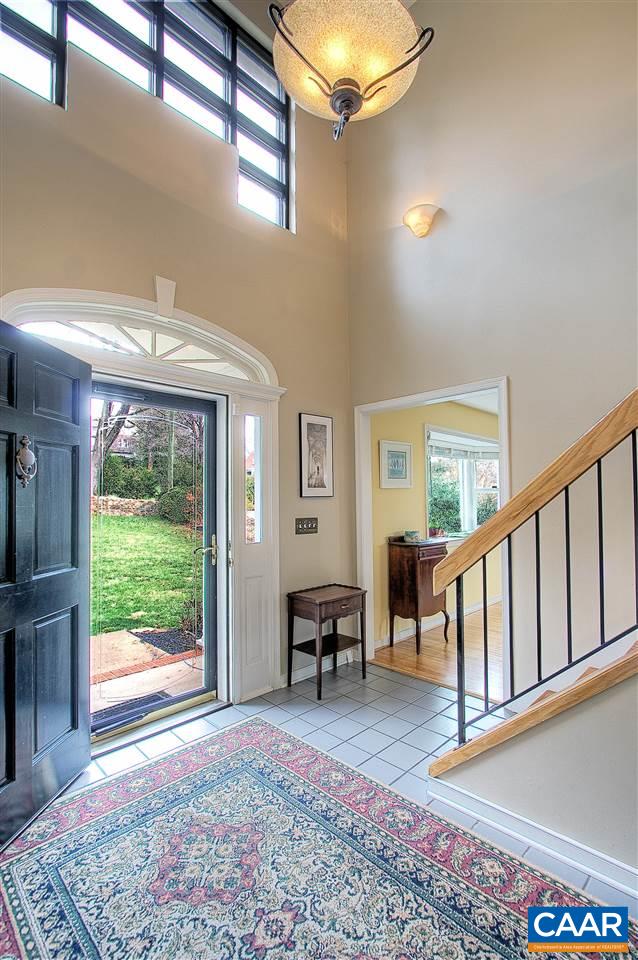 1532 Dairy Road Charlottesville, VA 22903 - Photo 3 of 42 The foyer soars 2-stories high and is lit by a modern-inspired asymmetrical grid window above the entry. The entry door has sidelites and an elegant palladian finished with impressive trim work.