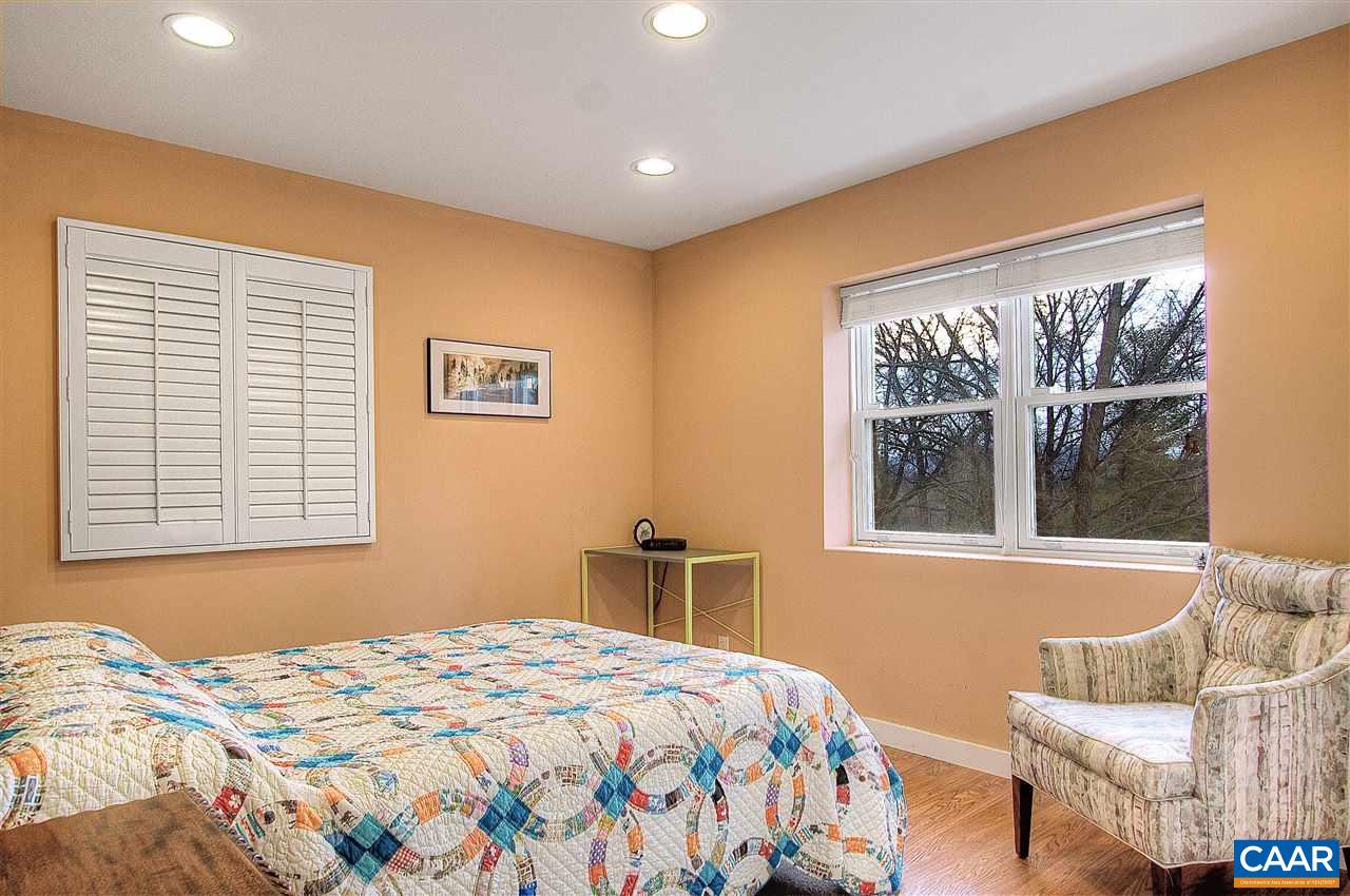 1532 Dairy Road Charlottesville, VA 22903 - Photo 32 of 42 This cheery corner room is so bright, it's hard to believe it's in the basement. A large double window looks out onto the backyard, offering garden views. With adjoining bath, it's ideal as a guest/teen suite. Or, use it for sewing, office, hobby, gym...