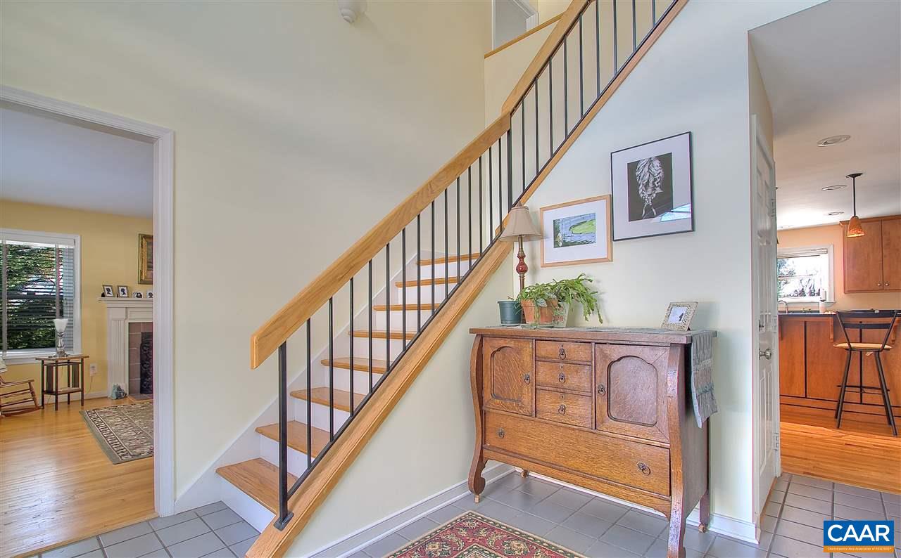 1532 Dairy Road Charlottesville, VA 22903 - Photo 4 of 42 The spacious, open foyer is a lovely enhancement to the traditional center hall in this modern update of the classic floorplan. The open railing staircase with "loft" upstairs hall adds flair and a sense of openness.