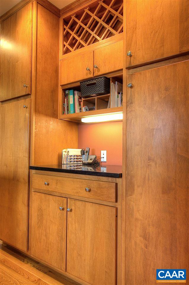 1532 Dairy Road Charlottesville, VA 22903 - Photo 6 of 42 A convenient butler's pantry provides a space for serving. Rich cherry cabinets with pull out drawers in every cupboard, are beautiful & functional. A wine rack, cubby holes & work surface are flanked by two pantry cupboards.