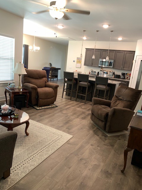 2125 Hospitality Lane Murfreesboro, TN 37128 - Photo 5 of 6 a living room with furniture kitchen view and a wooden floor