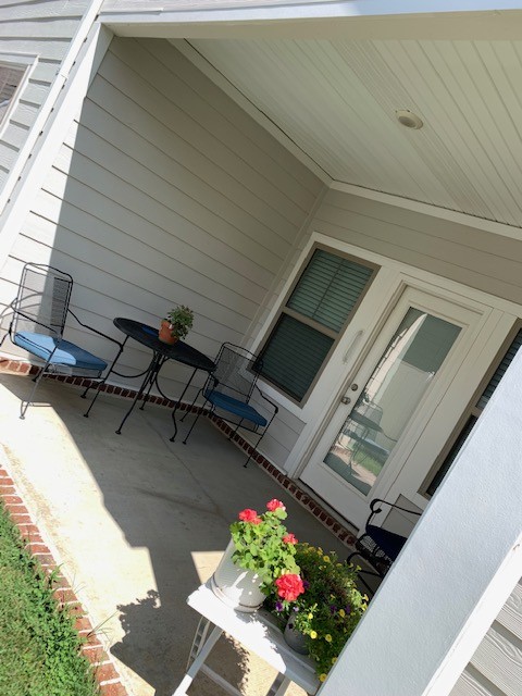 2125 Hospitality Lane Murfreesboro, TN 37128 - Photo 6 of 6 a vase of flowers sitting on a floor