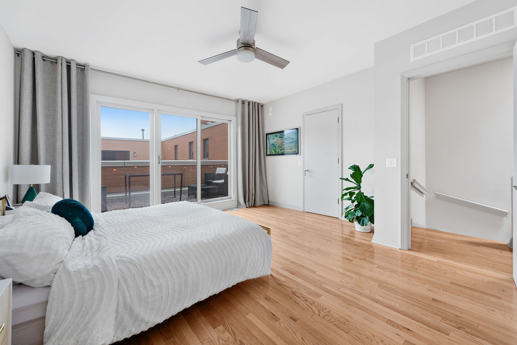 Undisclosed Address Chicago, IL 60607 - Photo 11 of 20 a bedroom with a bed potted plant and a window