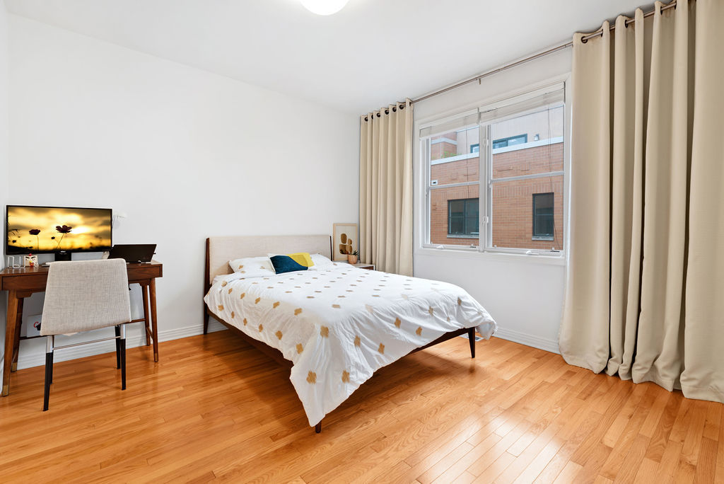 Undisclosed Address Chicago, IL 60607 - Photo 14 of 20 a bedroom with a bed and wooden floor