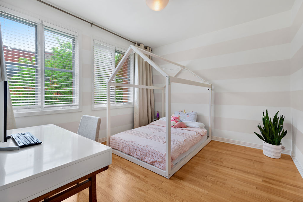 Undisclosed Address Chicago, IL 60607 - Photo 16 of 20 a bedroom with a bed table and a window