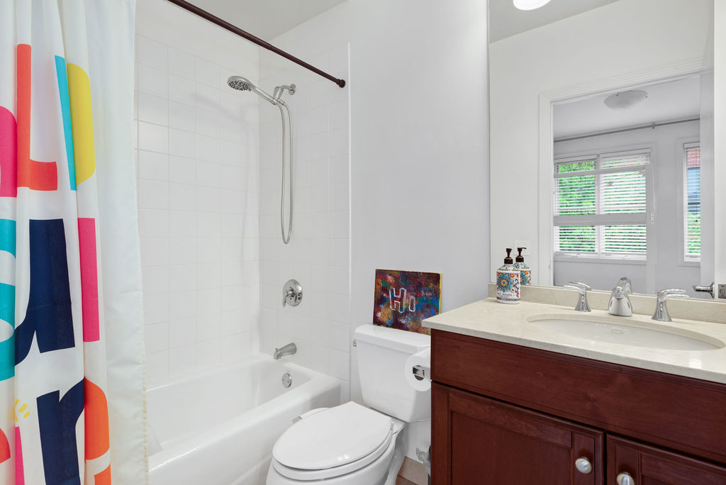 Undisclosed Address Chicago, IL 60607 - Photo 17 of 20 a bathroom with a sink a toilet and shower