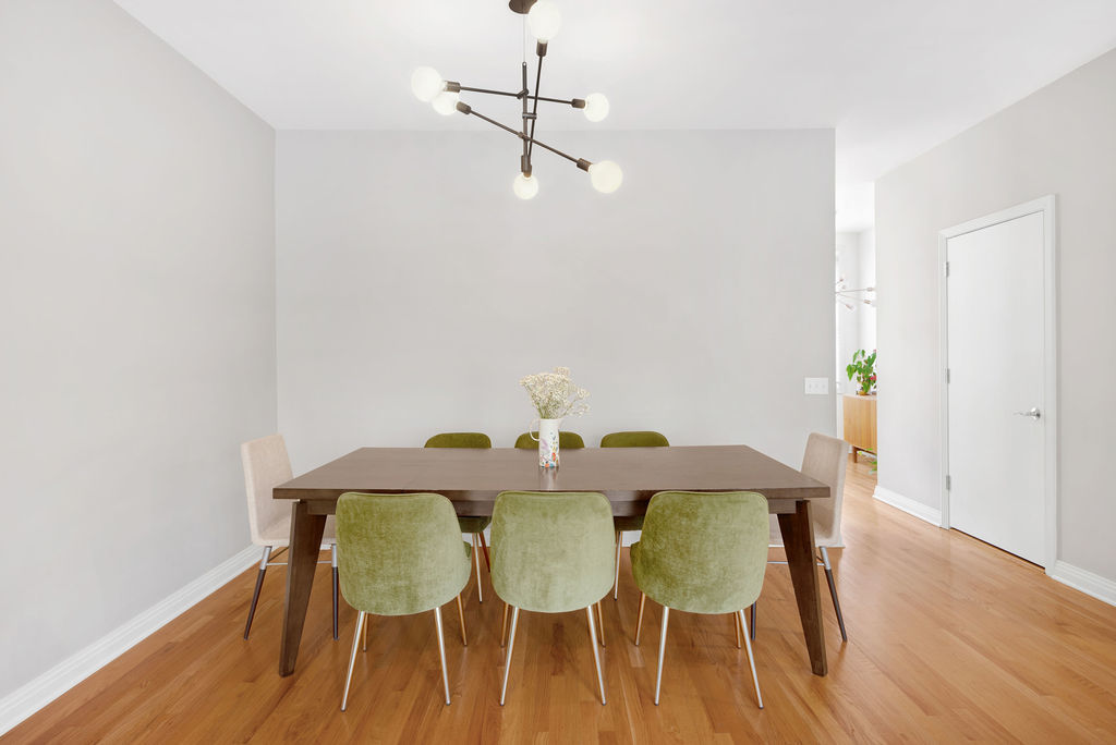 Undisclosed Address Chicago, IL 60607 - Photo 4 of 20 a view of a dining room with furniture and wooden floor