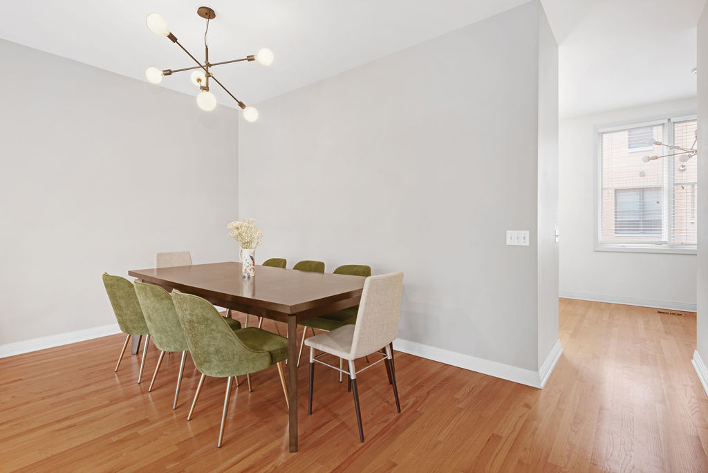 Undisclosed Address Chicago, IL 60607 - Photo 5 of 20 a view of a dining room with furniture and wooden floor