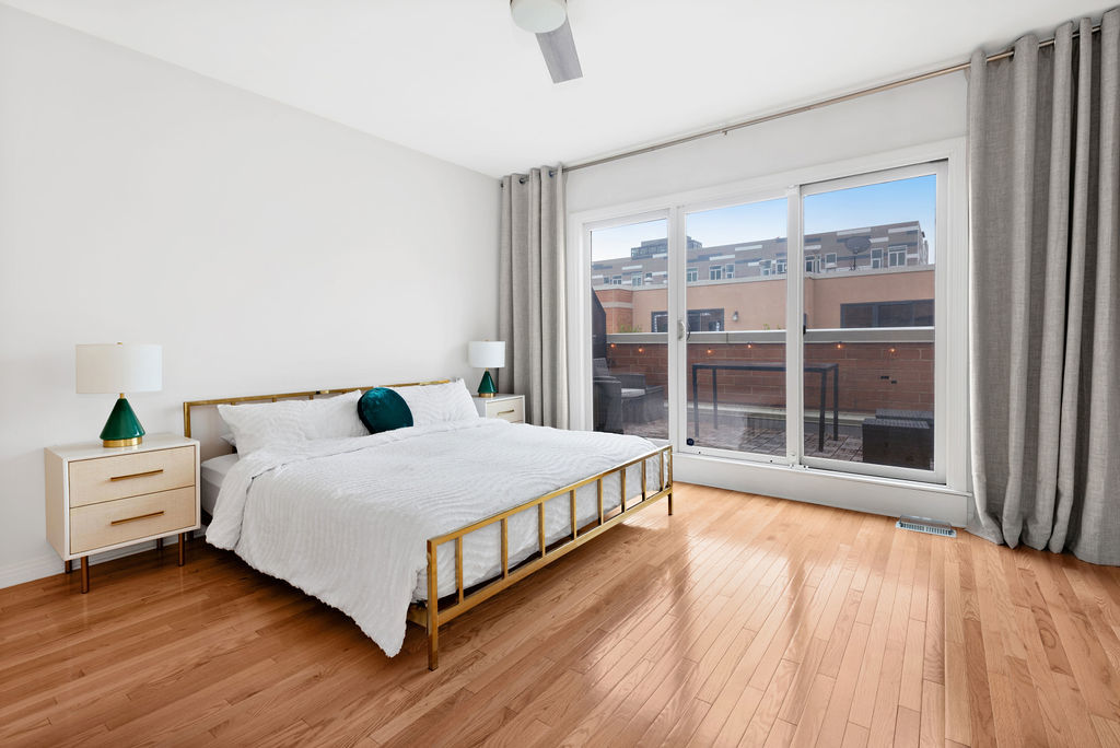 Undisclosed Address Chicago, IL 60607 - Photo 10 of 20 a bedroom with a bed and a large window