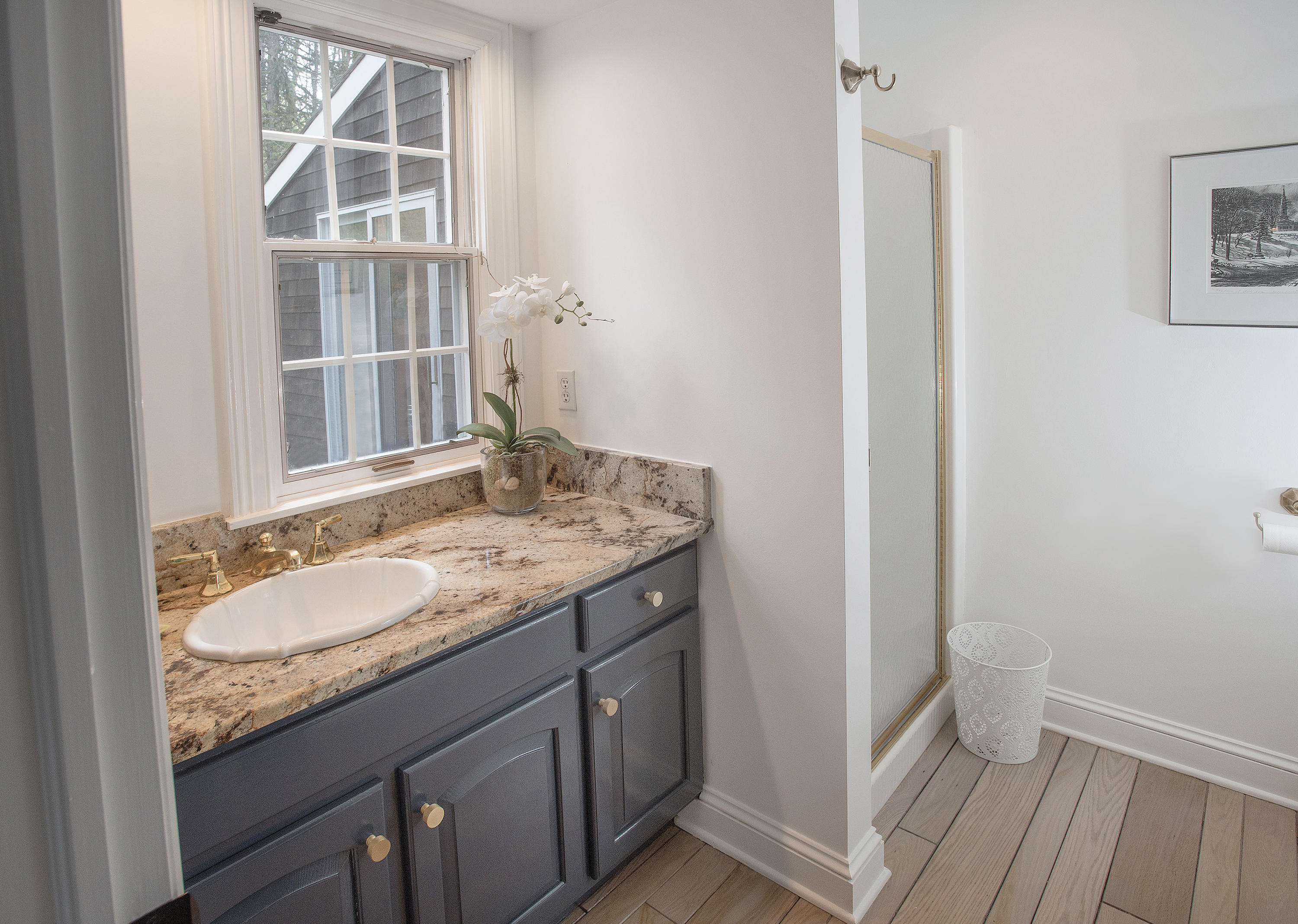 45 Brushy Ridge Road New Canaan, CT 06840 - Photo 14 of 23 a bathroom with a granite countertop sink and a mirror