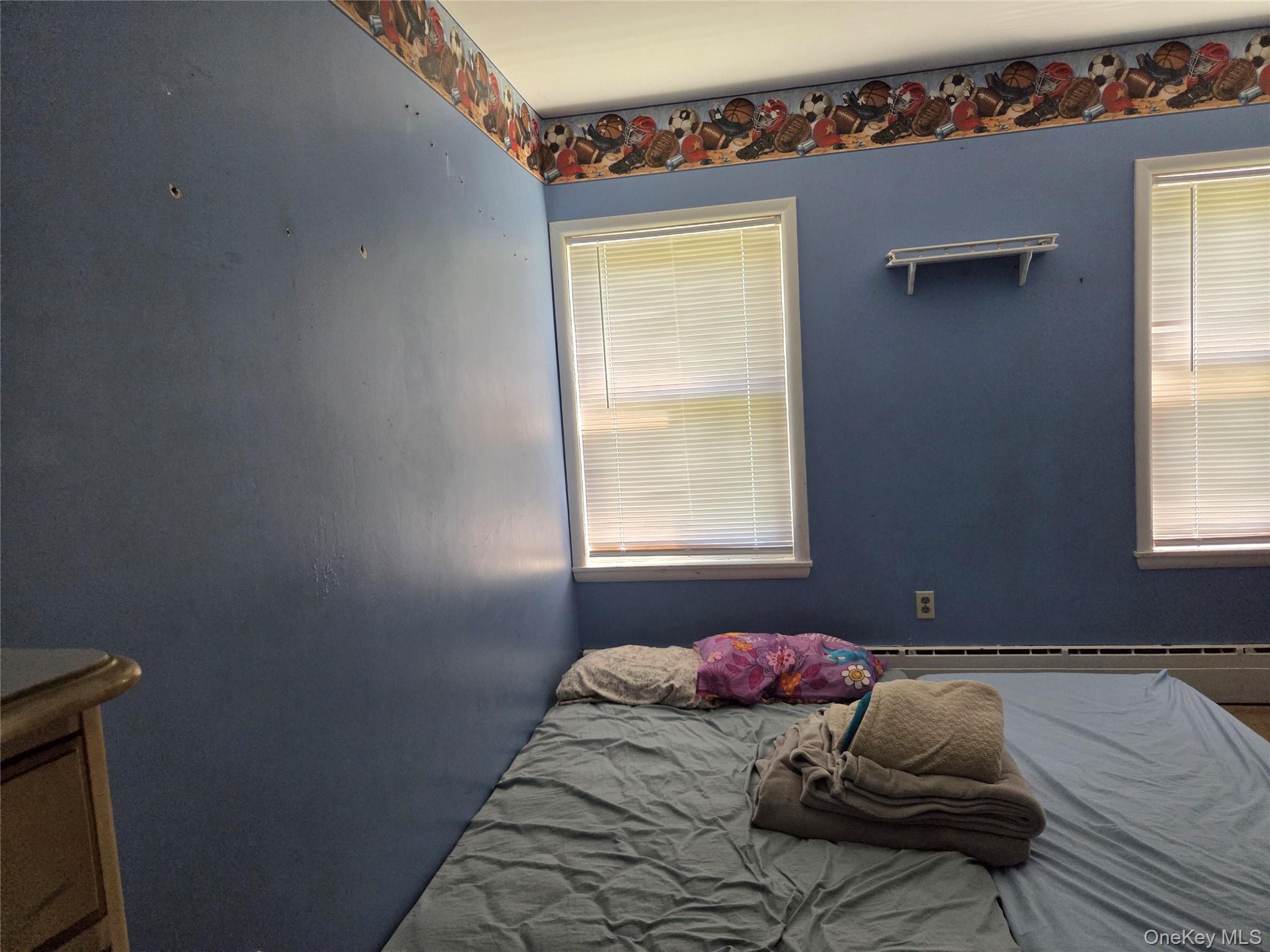 125 Zimmerman Road Loch Sheldrake, NY 12759 - Photo 10 of 43 a bedroom with a bed and window