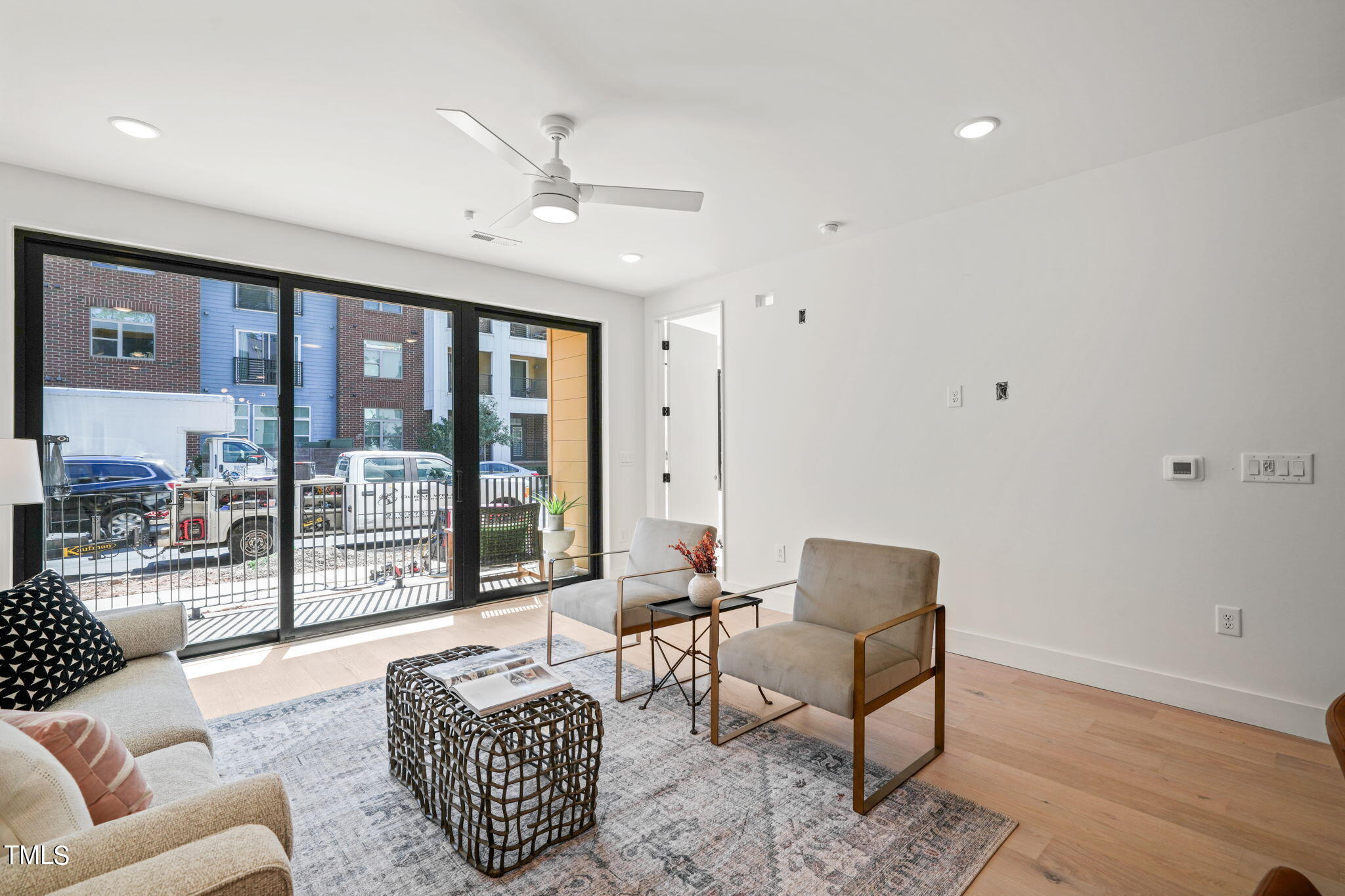 29 Enterprise Street, Unit 305 Raleigh, NC 27607 - Photo 13 of 48 a living room with furniture and a large window