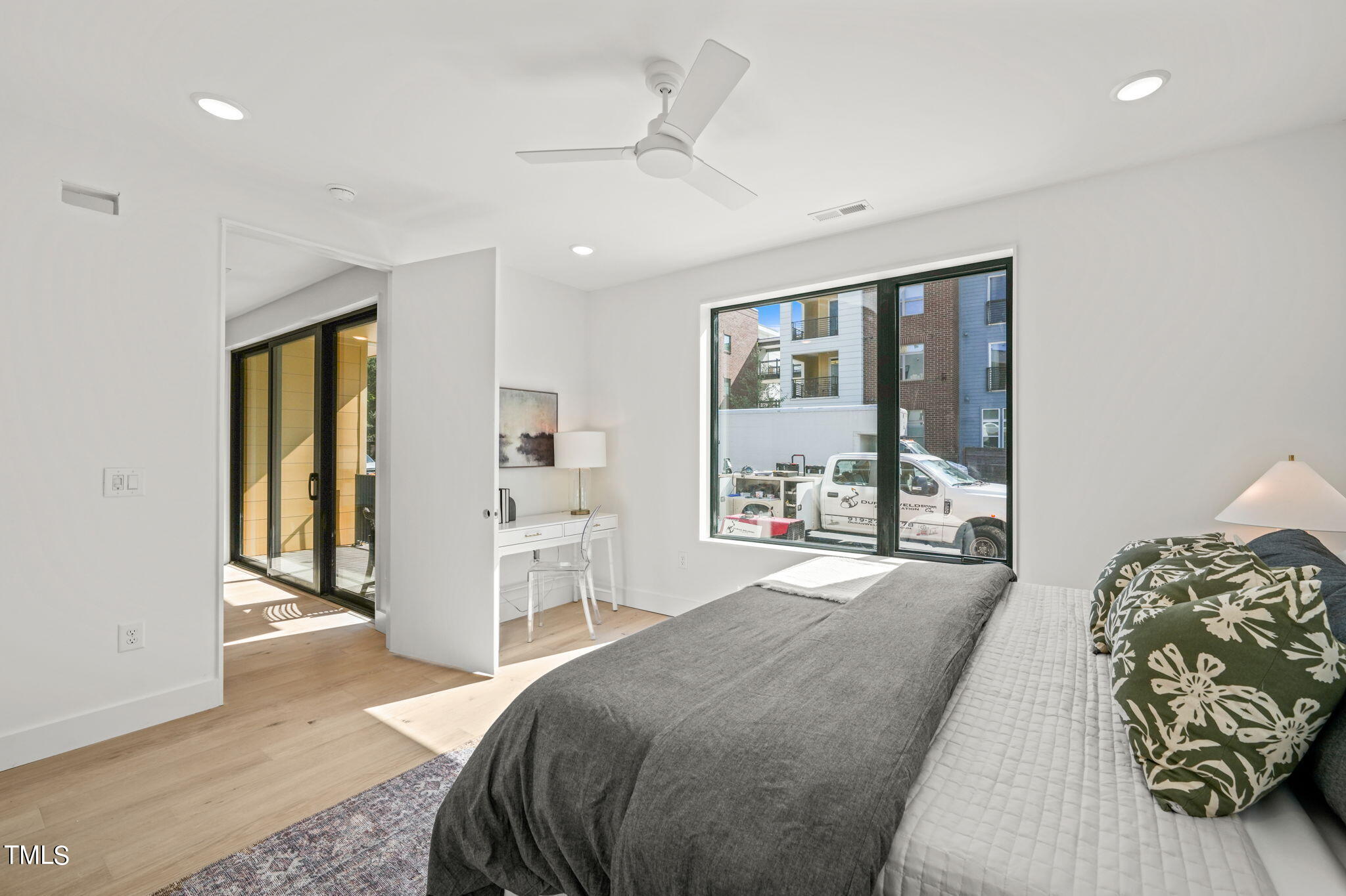 29 Enterprise Street, Unit 305 Raleigh, NC 27607 - Photo 16 of 48 a spacious bedroom with a large bed and a window