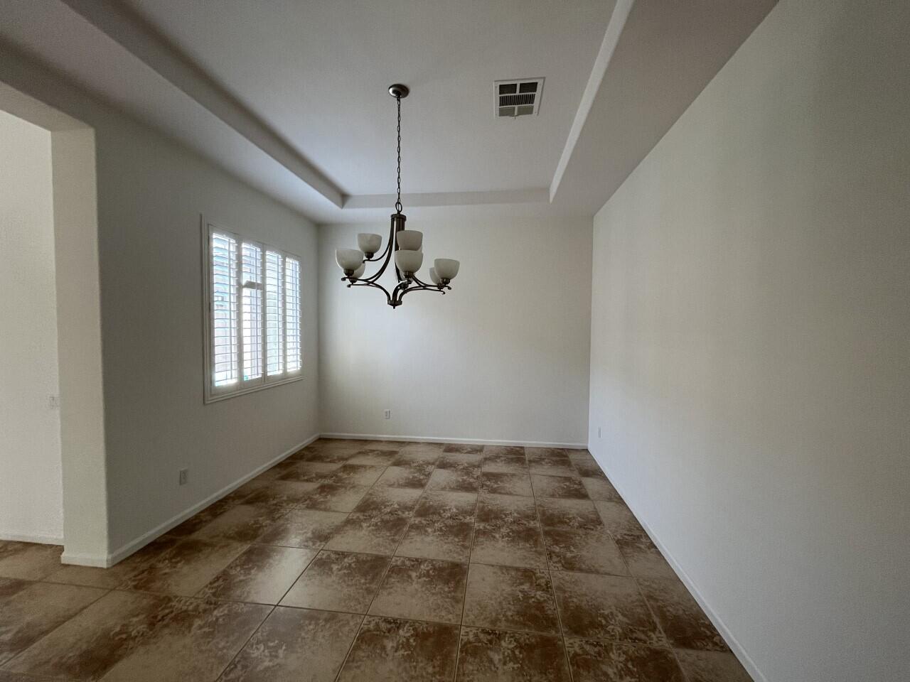 40844 Piazza Del Paradiso Indio, CA 92203 - Photo 11 of 22 a view of empty room with windows