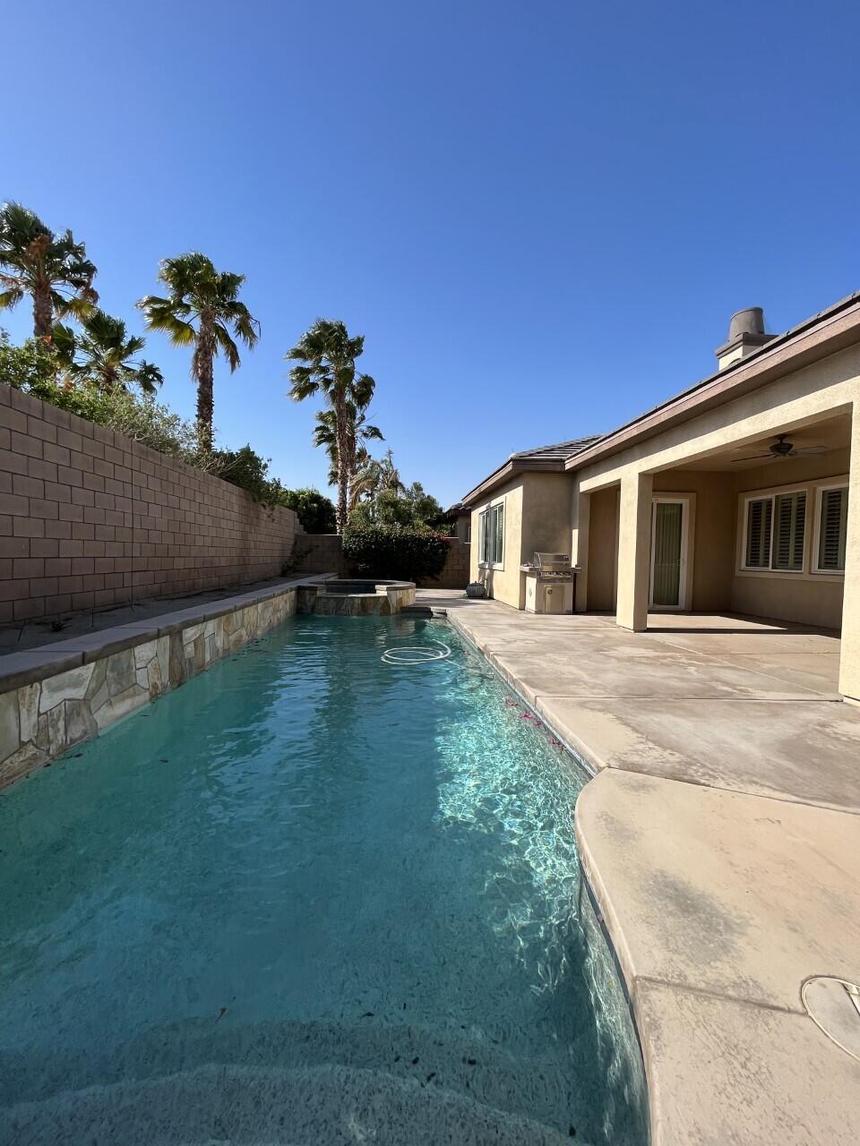 40844 Piazza Del Paradiso Indio, CA 92203 - Photo 19 of 22 a front view of a house with a yard