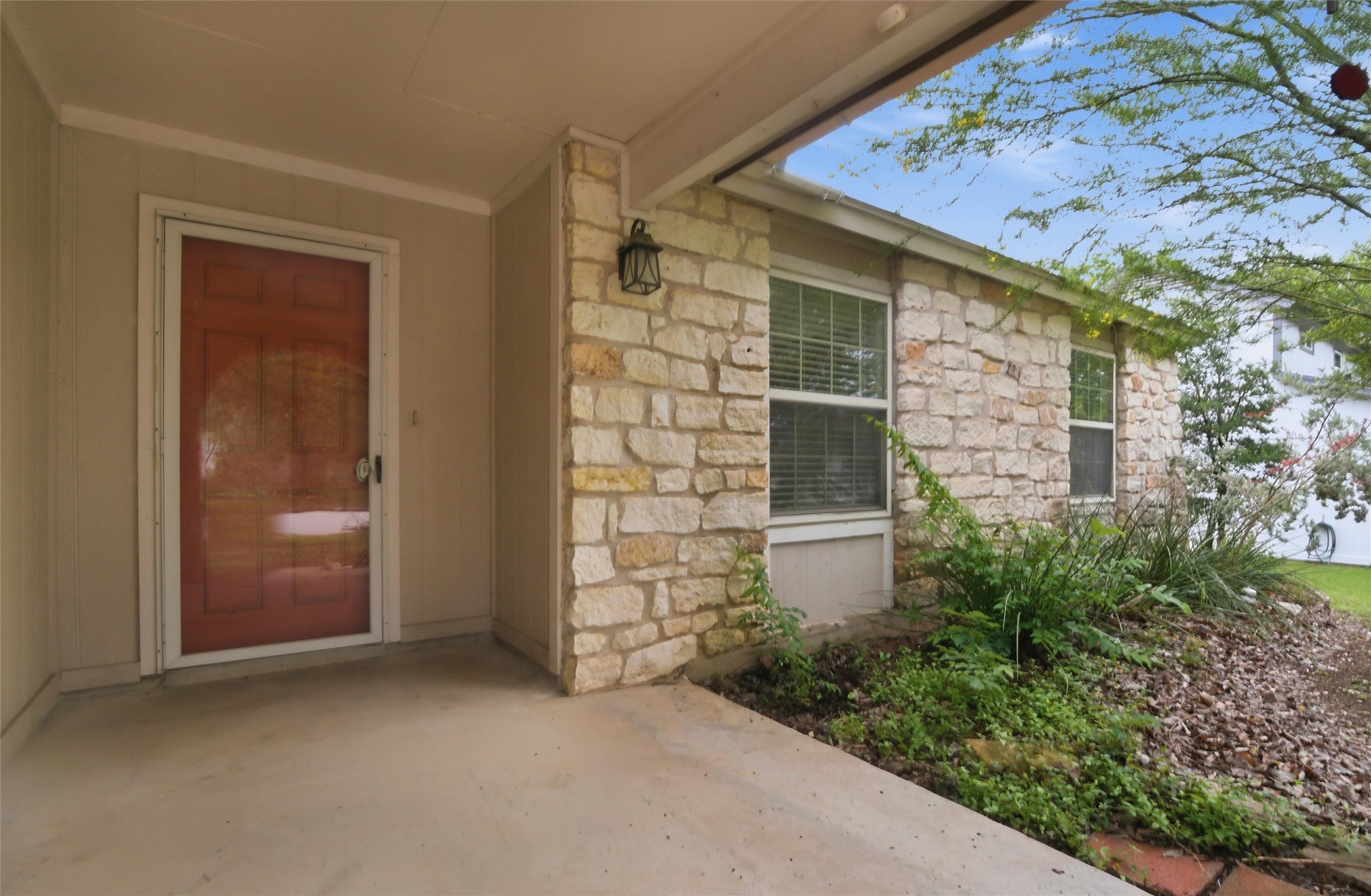2000 Magazine Street Austin, TX 78727 - Photo 2 of 30 A welcoming front entry with natural stone veneer offers a charming first impression.
