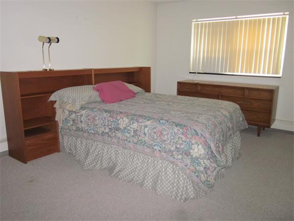 73 Walnut Street, Unit 6 Newton, MA 02460 - Photo 4 of 8 a bedroom with a bed and a window