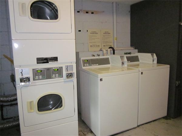 73 Walnut Street, Unit 6 Newton, MA 02460 - Photo 8 of 8 a utility room with dryer and washer