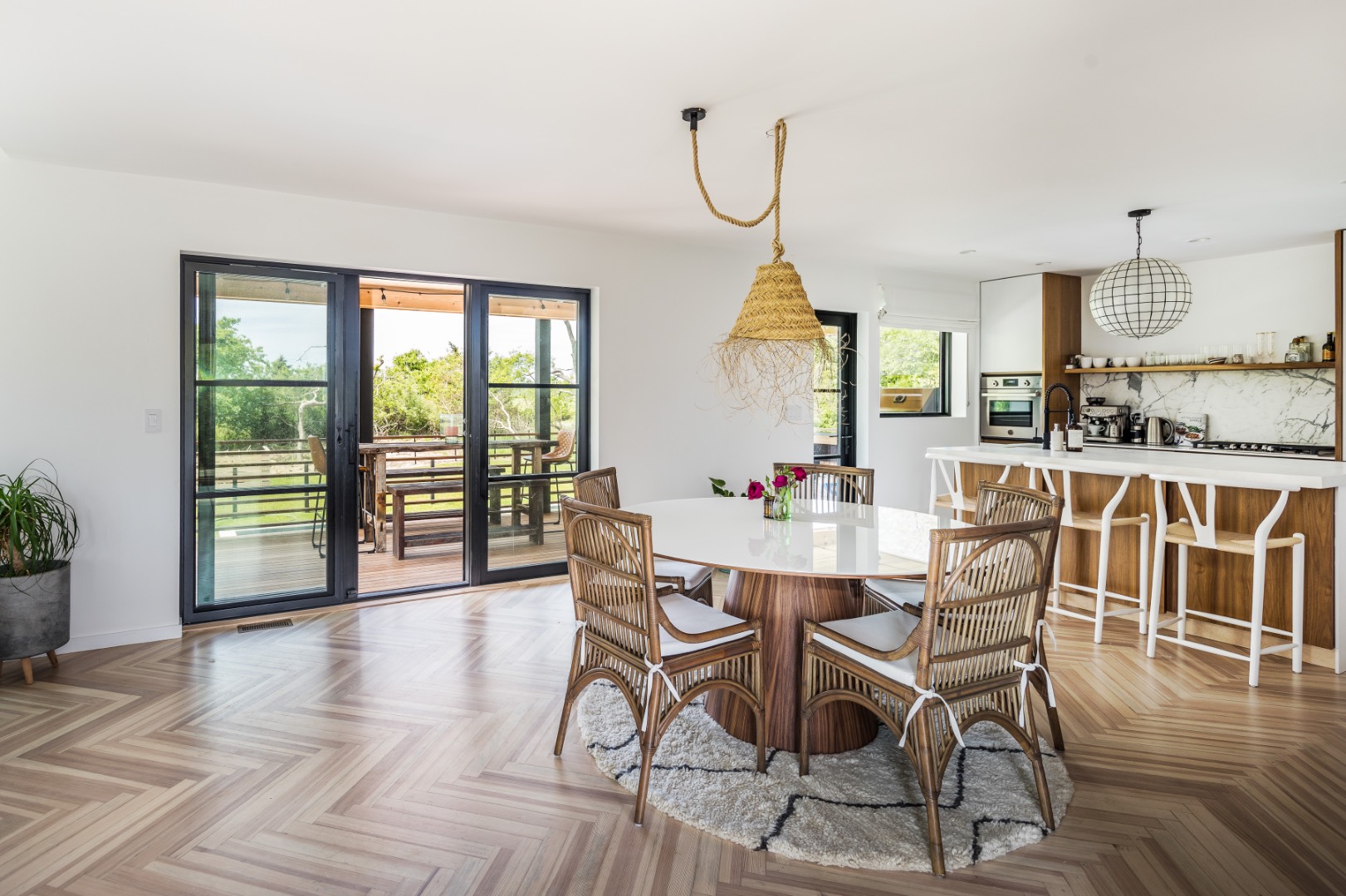 5 Fort Hill Road Montauk, NY 11954 - Photo 5 of 11 a view of a dining room with furniture window and wooden floor