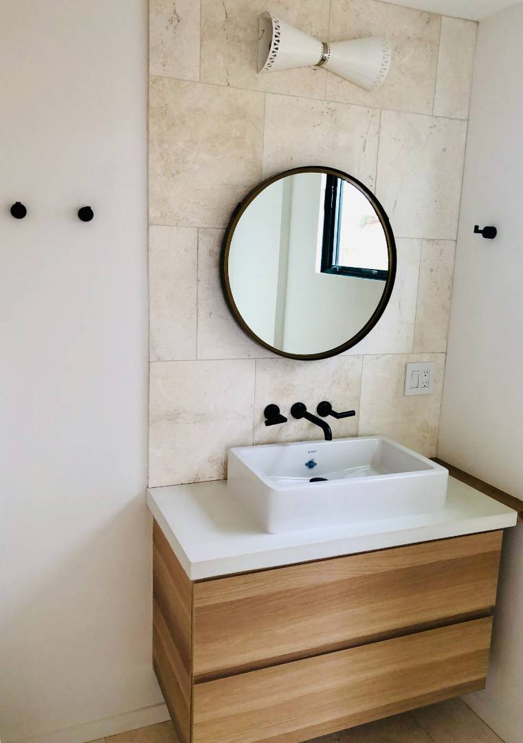 5 Fort Hill Road Montauk, NY 11954 - Photo 10 of 11 a bathroom with a sink and mirror