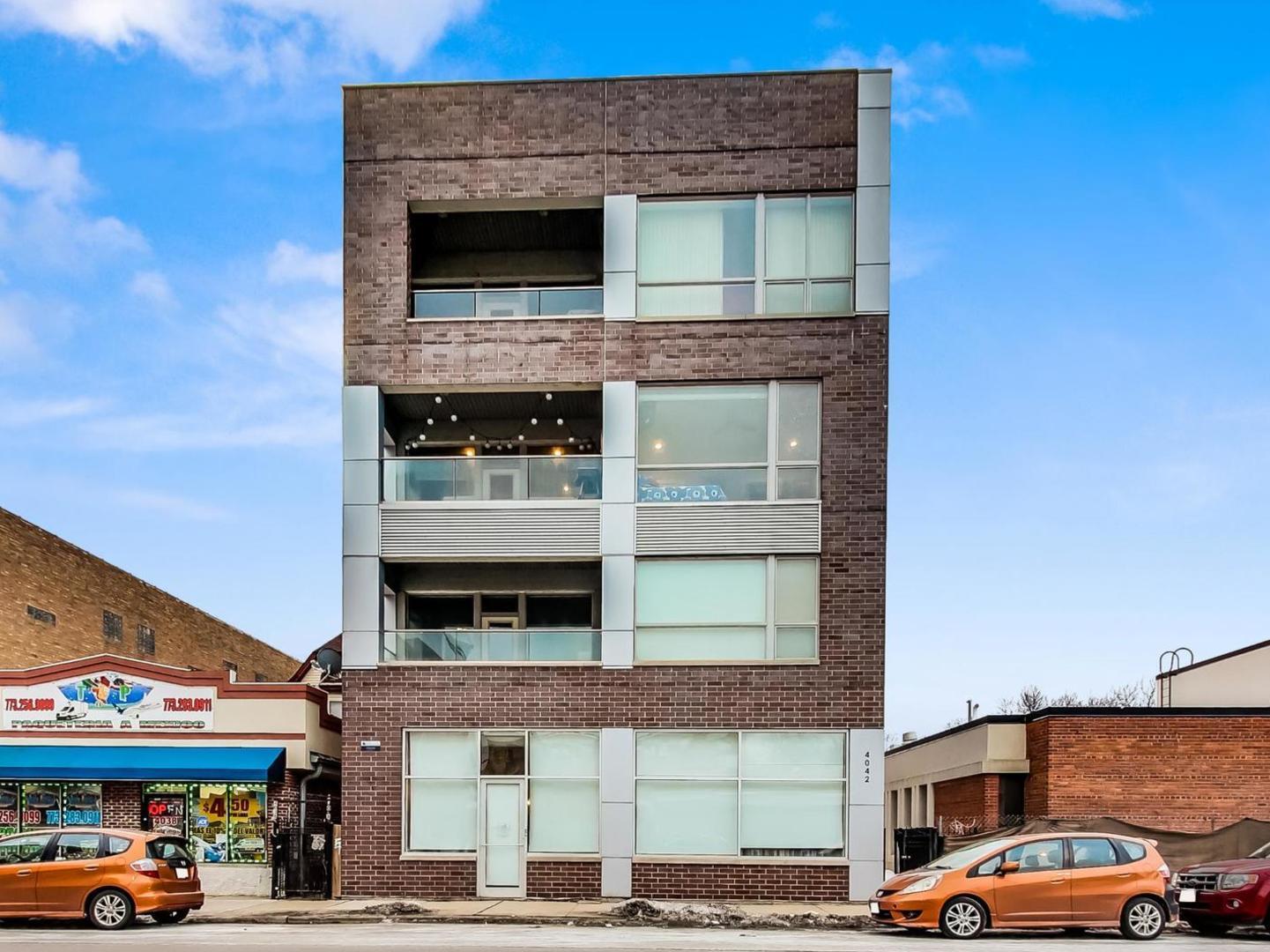 a front view of a building with parking