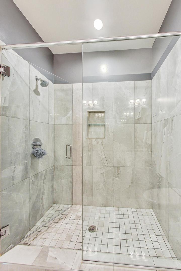 4042 North Pulaski Road, Unit 4E Chicago, IL 60641 - Photo 15 of 32 a bathroom with a shower