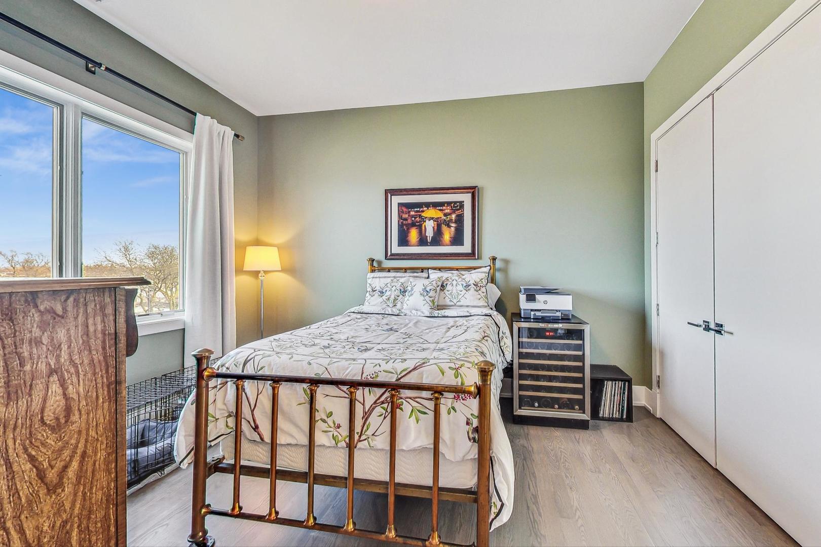 4042 North Pulaski Road, Unit 4E Chicago, IL 60641 - Photo 17 of 32 a bedroom with a bed and a dresser