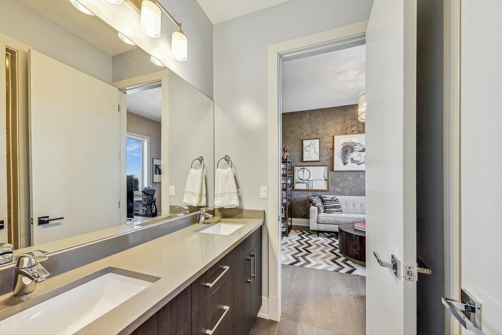 4042 North Pulaski Road, Unit 4E Chicago, IL 60641 - Photo 19 of 32 a bathroom with a sink and a mirror