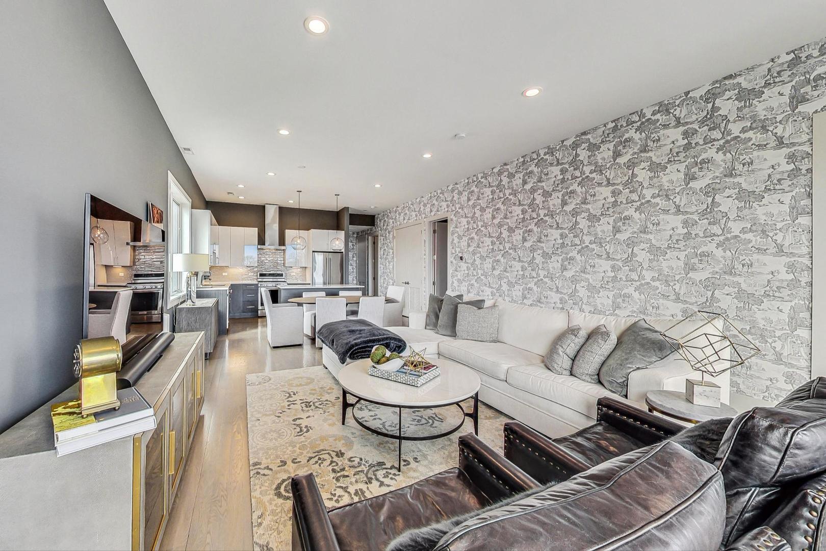 4042 North Pulaski Road, Unit 4E Chicago, IL 60641 - Photo 3 of 32 a living room with furniture and a dining table with rug