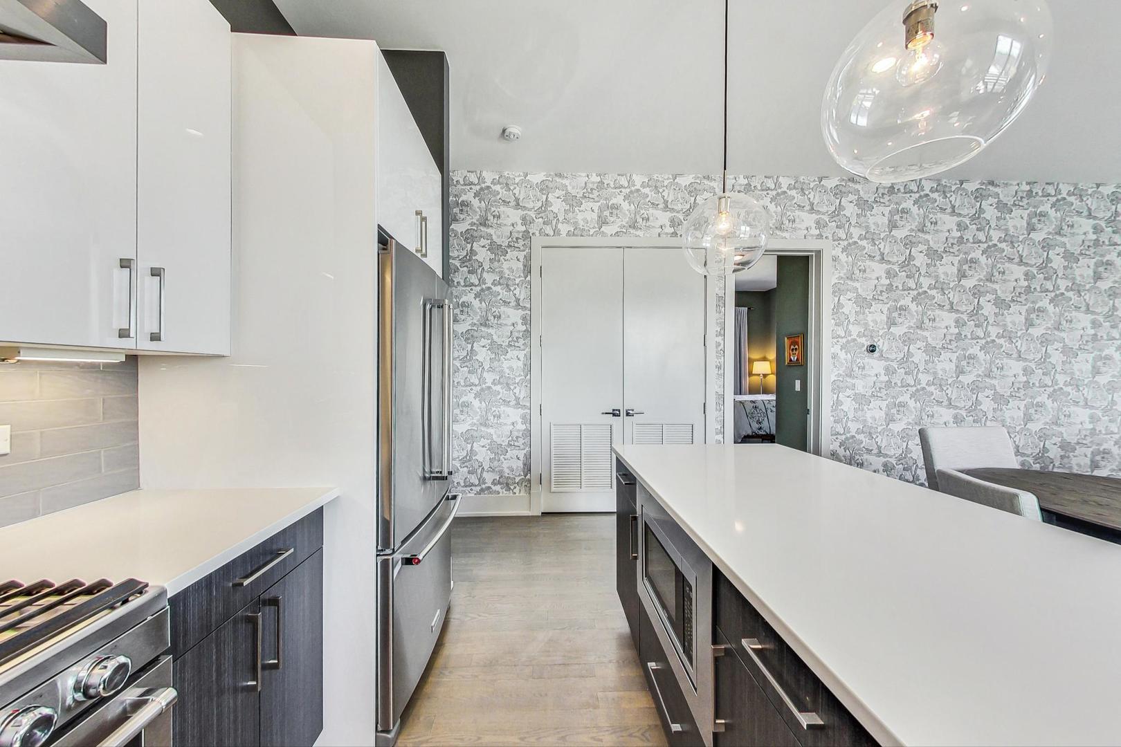 4042 North Pulaski Road, Unit 4E Chicago, IL 60641 - Photo 9 of 32 a spacious bathroom with a sink and a mirror