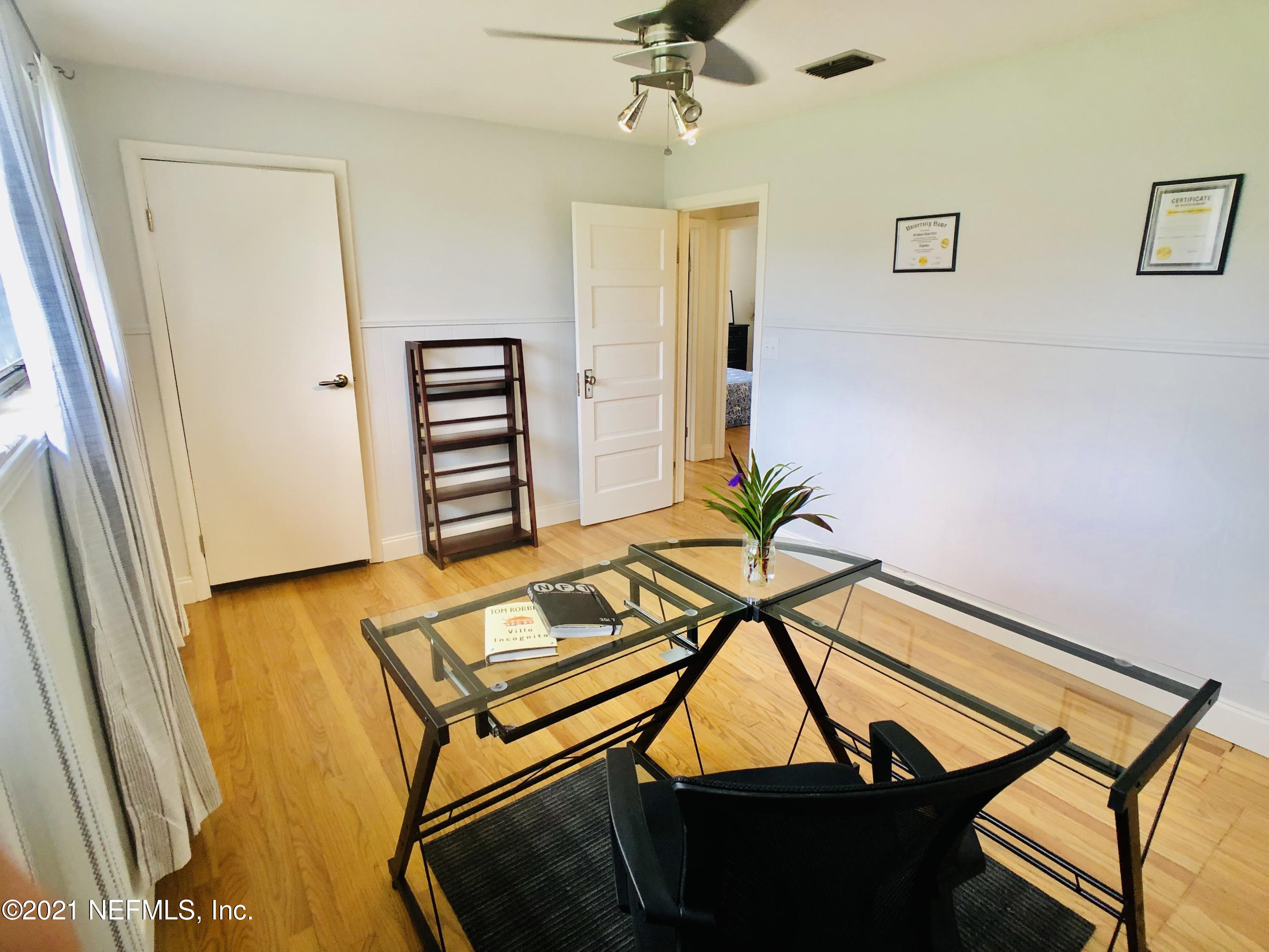 9831 Cunningham Road Jacksonville, FL 32246 - Photo 15 of 25 a view of a room with lounge chair and wooden floor