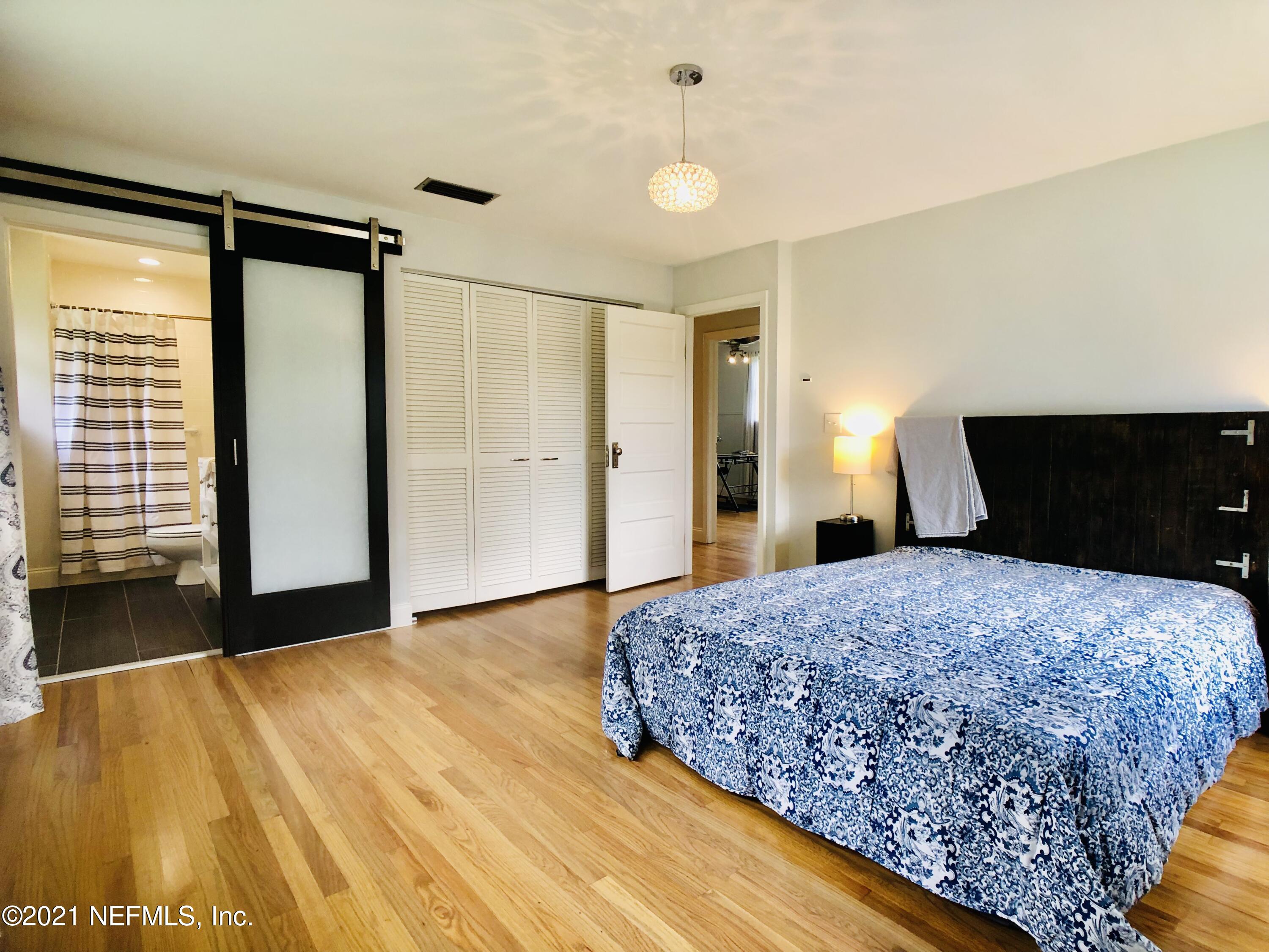 9831 Cunningham Road Jacksonville, FL 32246 - Photo 18 of 25 a bedroom with a bed and a dresser