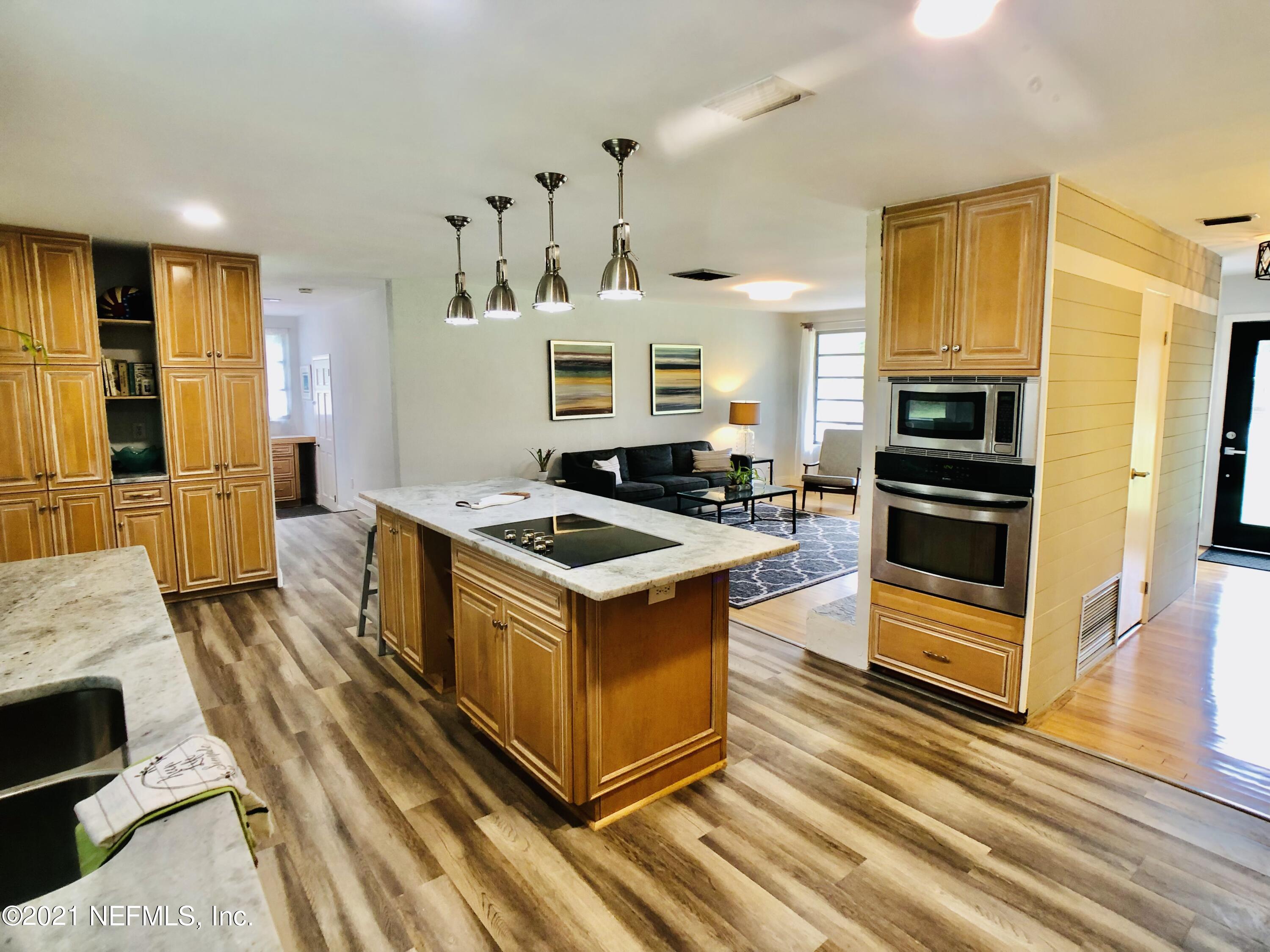 9831 Cunningham Road Jacksonville, FL 32246 - Photo 5 of 25 a kitchen with a stove and a refrigerator