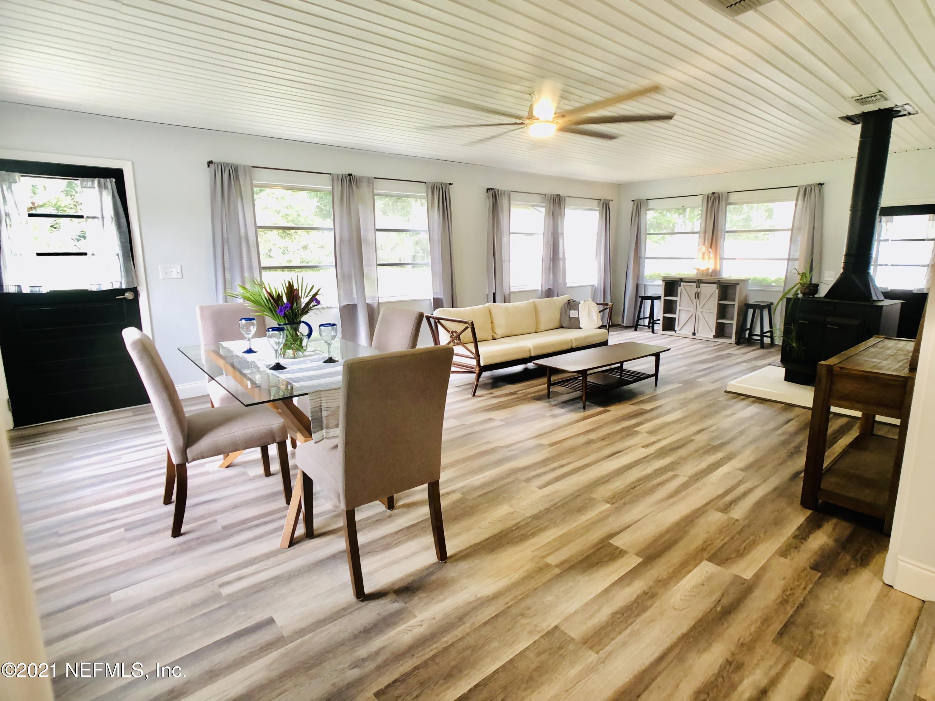 9831 Cunningham Road Jacksonville, FL 32246 - Photo 8 of 25 a living room with furniture and a wooden floor