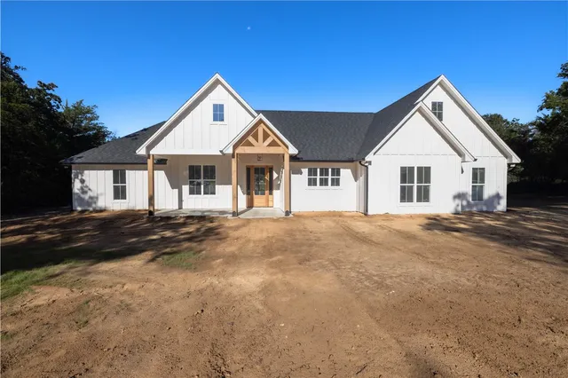 a view of house with yard and street view