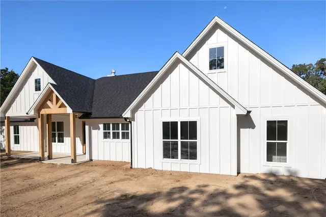a view of house with yard