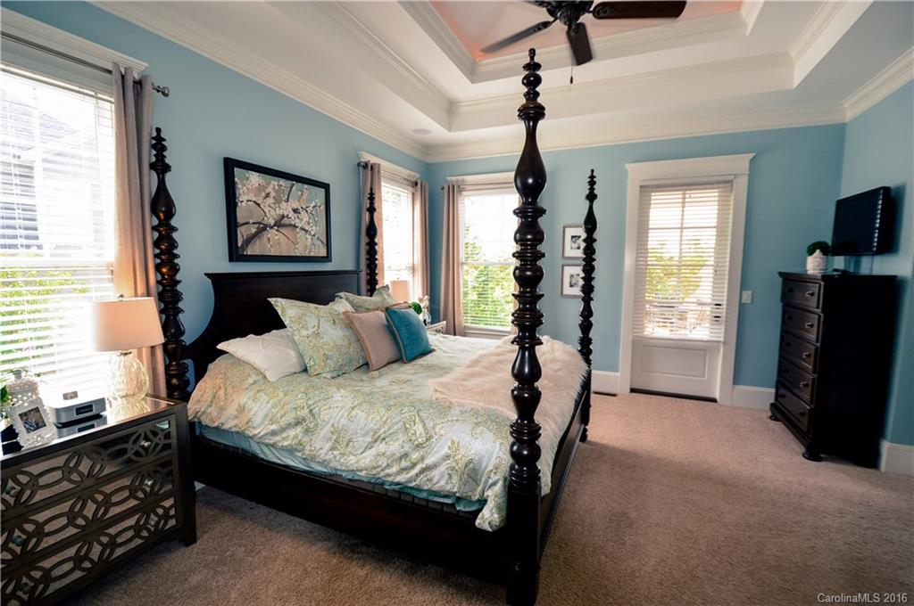 1024 Perriwinkle Lane Fort Mill, SC 29708 - Photo 12 of 24 a bedroom with a bed a couch and a window