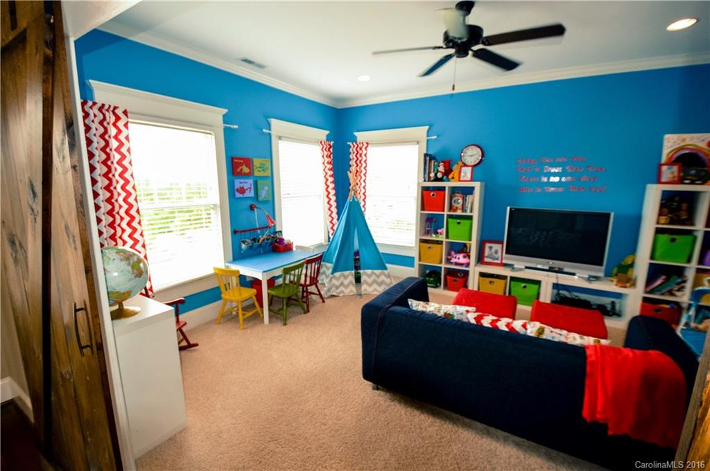 1024 Perriwinkle Lane Fort Mill, SC 29708 - Photo 22 of 24 a living room with furniture and a flat screen tv