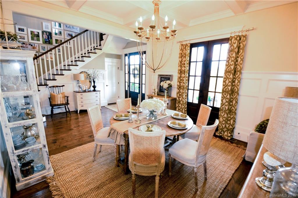 1024 Perriwinkle Lane Fort Mill, SC 29708 - Photo 4 of 24 a view of a dining room with furniture a chandelier and wooden floor